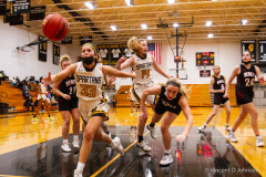 Marian Catholic's Sarah Segarra (33) dives for a loose ball during a game against Benet, in Chicago Heights on Wednesday Dec. 8, 2021. (Vincent D. Johnson / for the Naperville Sun).