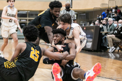 A scramble for a loose ball gets physical netween Mount Carmel's Angelo Ciaravino and King's Joseph Spaulding (with ball), in Chicago on Tuesday, Nov. 30, 2021.  (Vincent D. Johnson/for the Daily Southtown).