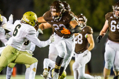 Joliet Catholic's Jordan Anderson (23) gets ready to collide with Sacred Heart-Griffin's Madixx Morris (6) on the way to gaining some of his 306 yards rushing during the IHSA Class 4A State Final in DeKalb on Friday, Nov. 26, 2021. (Vincent D. Johnson / for the Daily Southtown).