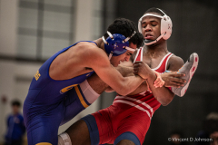 Flossmoor’s Jayden Robinson (red) against Sandburg's Farris Askar  (blue) in the 145 lbs weight class, in Flossmoor on Thursday, Dec. 9, 2021. (Vincent D. Johnson / for the Daily Southtown).