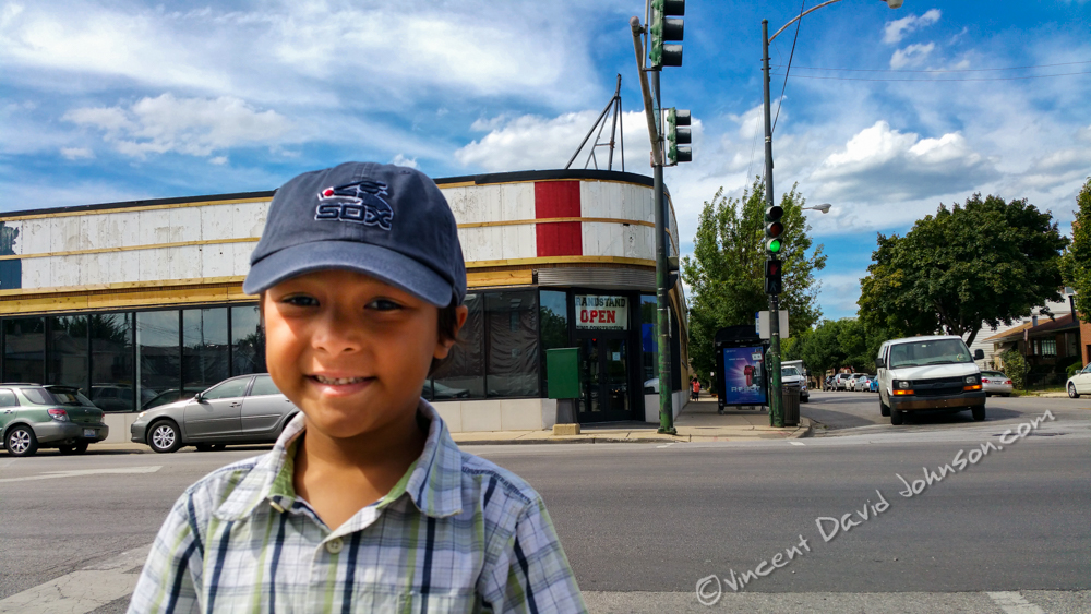 Buying AX a White Sox hat for his field trip to the game.  Photo copyright of Vincent David Johnson. http://www.VincentDavidJohnson.com