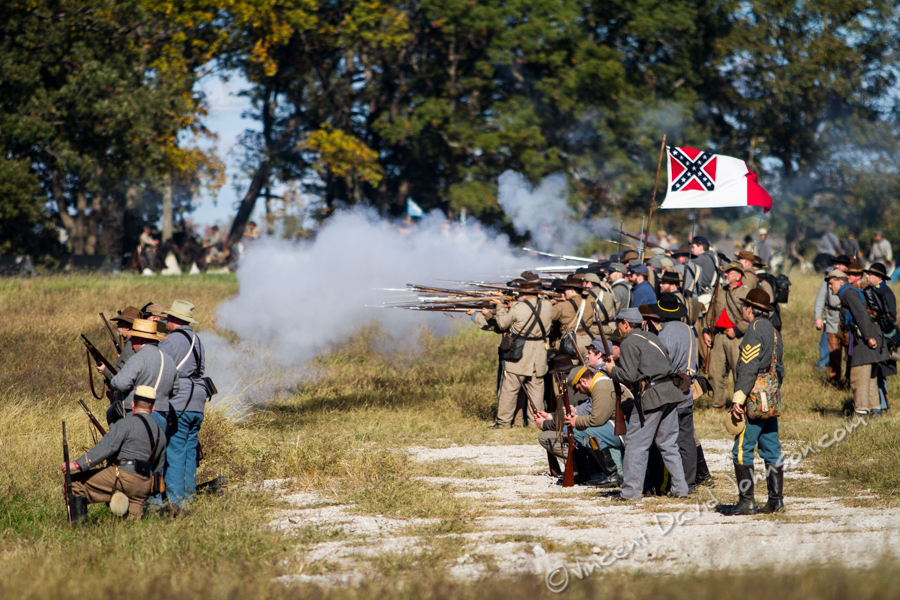 VINCENT D. JOHNSON - For Shaw Media Confederate reenactors fire upon their fellow reenactors on the Union side, Oct. 17, 2015. The battle reenactment took place at Dollinger Family Farm.