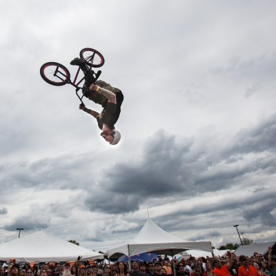 Jody Donnelly, of the Ride -n- Grind Stunt team did a back flip over a ramp on his BMX bike . Donnelly & his teammates were part of a mid day show inbetween bands during the 6th annual Iron Horse Roundup motorcycle show hosted by Austin's restaurant. The event was held in  the parking lot of the Libertyville Sports Complex. Vincent D. Johnson/for Sun-Times Media. Sunday, May 2nd 2010.