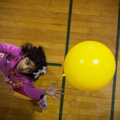 Prisha Sherdiwala, 5, of Oak Park, tries to keep an inflated balloon off the ground and in a circle, in a game called the "Balloon Valley Challenge". Prisha, was one of dozens of kids taking part in the YMCA Healthy Kids Day at the West Cook YMCA in Oak Park. Vincent D. Johnson~for
Sun-Times Media.