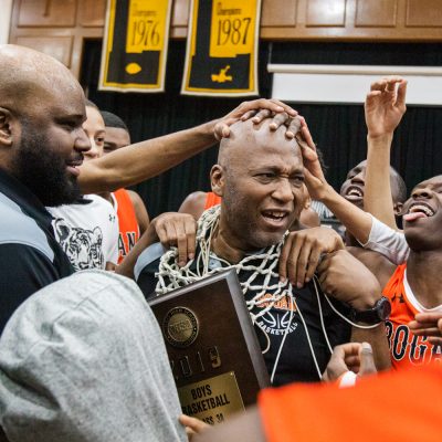 Bogan's head coach Arthur Goodwin gets a new necklace and a some love from his players after the Bengals won the class 3A St. Laurence Sectional championships 85-78 over Morgan Park, Friday, March 8, 2019, in Burbank. (Vincent D. Johnson-Daily Southtown).