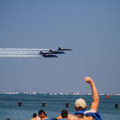 Chicago, 8/16/15--A man pumps his fist in the air as the Navy Blue Angels pass by the crowd in formation during the 2015 Chicago Air & Water Show at North Avenue Beach. | Vincent D. Johnson/for Sun-Times Media