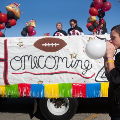 Park Ridge, 09/17/11-- Freshman  Matt Kelly, blows up a ballon for one of the Maine South Homecoming parade vehicles. Vincent D. Johnson~for Sun-Times Media